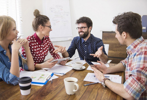 Happy employees working together